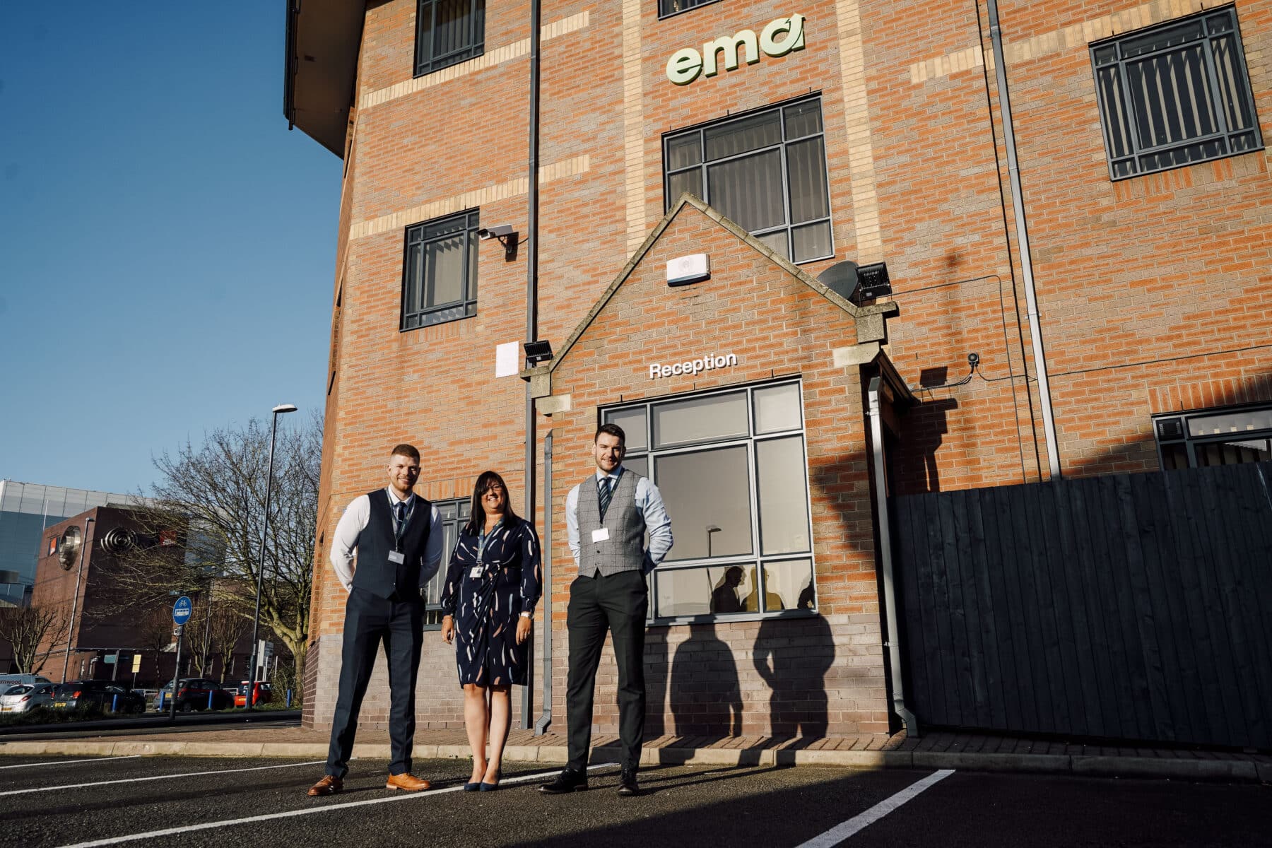 EMA Training's Senior Leadership Team standing outside EMA's high-tech Digital Hub in Derby City Centre
