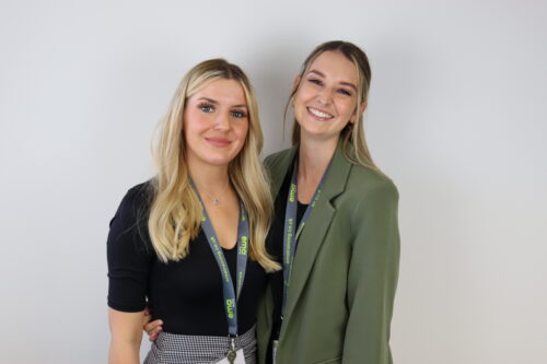 EMA Training's Recruitment Team, Abby (left) and Hannah (right) smiling for the camera.