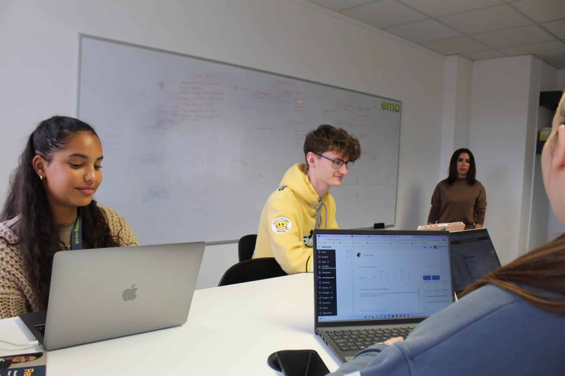 Level 4 Marketing Apprentices in class. Liberty is the furthest to the left. Standing is the Marketing Trainer, Louisa.