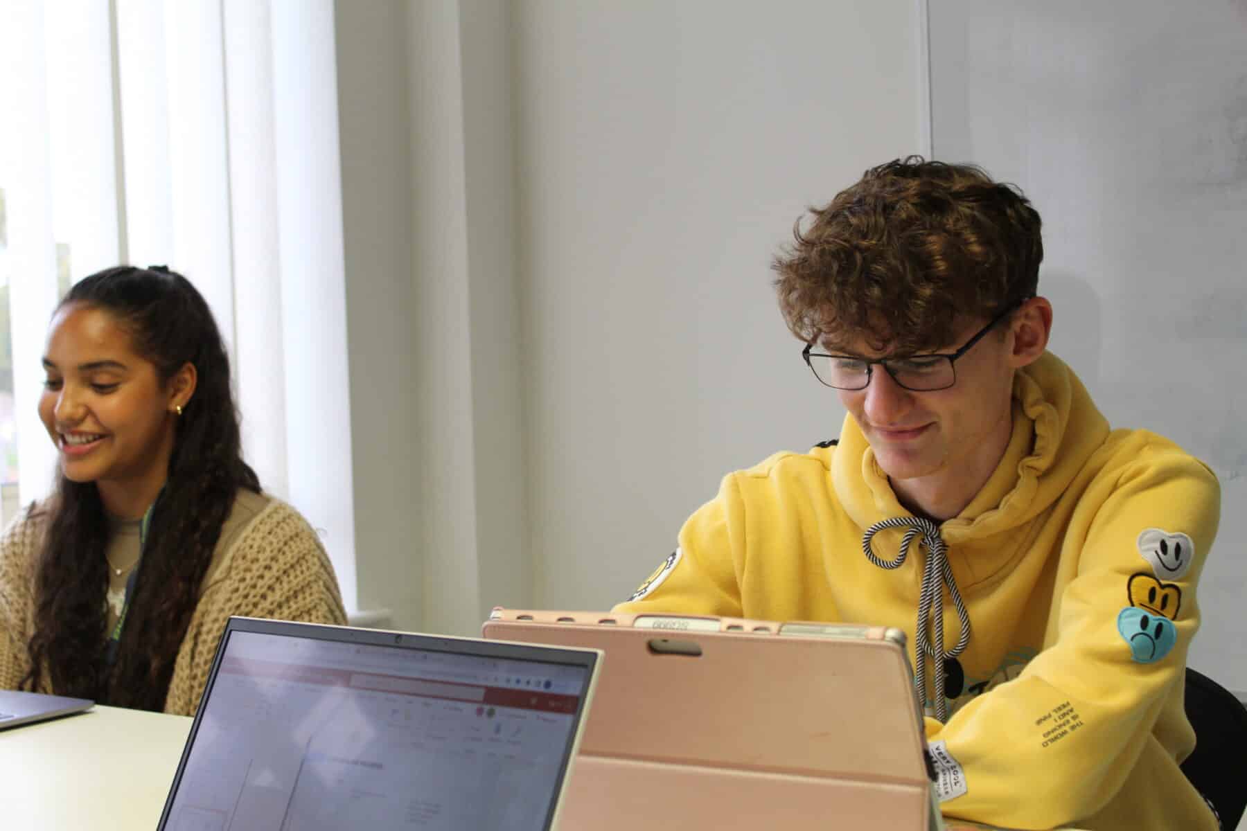 Two Marketing Apprentices sat in class.