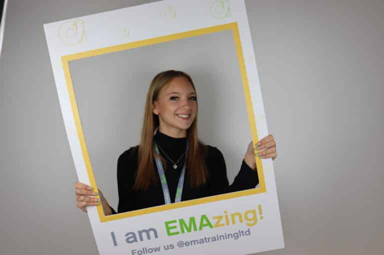 EMA's Finance Apprentice, Lupita, posing in an 