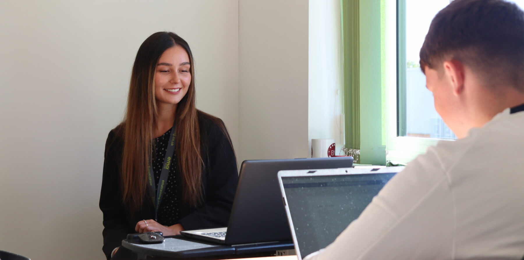 AAT Trainer, Hollie, offering apprentice advice and tips to an accountancy apprentice in EMA Training's Finance Training Hub.