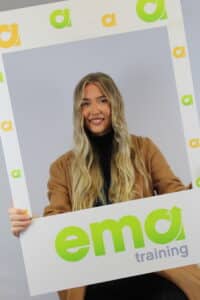 Payroll Mentor/ Trainer, Amy posing in EMA selfie frame.