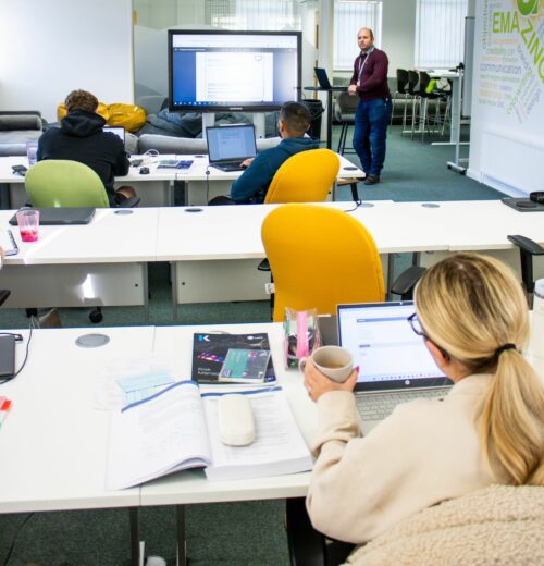 Commercial training learners in classroom